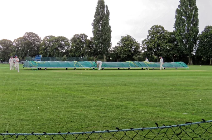 Mobile covers protecting a cricket pitch at Sandwich Town Cricket Club