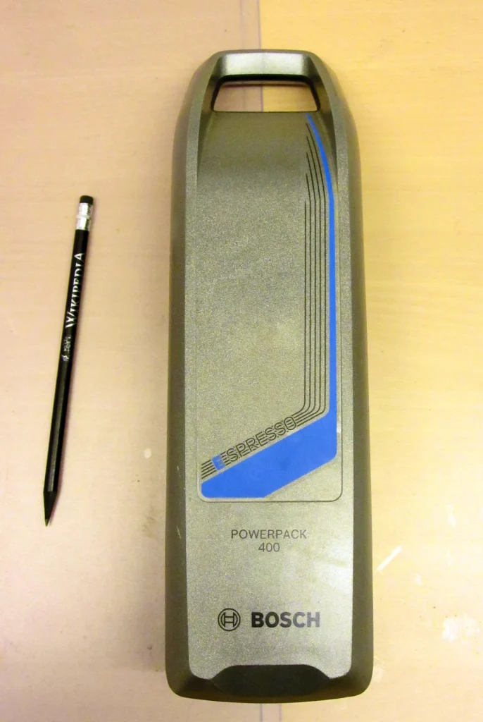 A Bosch PowerPack 400 electric-bicycle battery beside a pencil