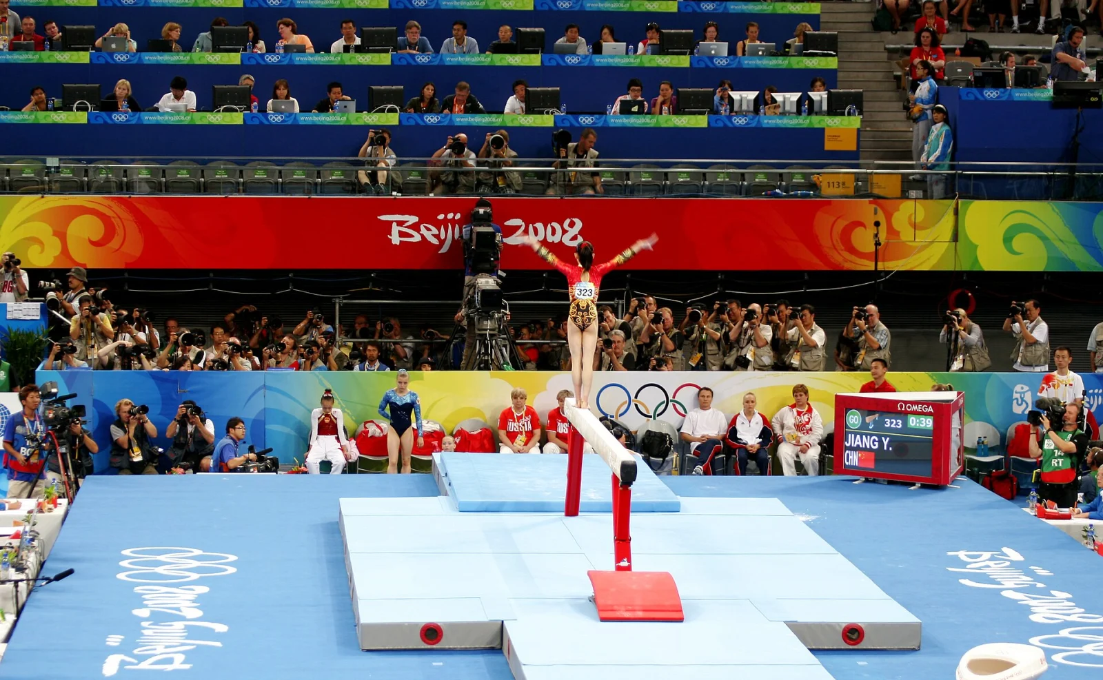 Jiang Yuyuan performing on the balance beam at a gymnastics competition