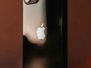 An Apple iPhone resting on a table