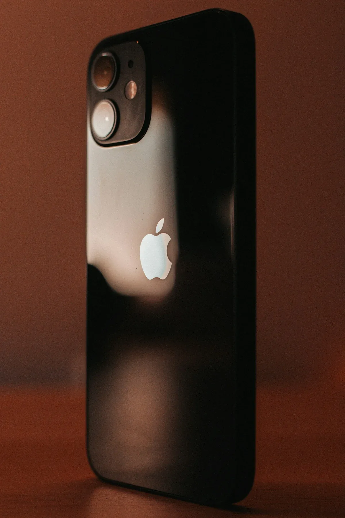 An Apple iPhone resting on a table