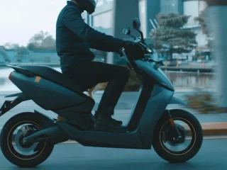 A rider on an Ather 450X electric scooter