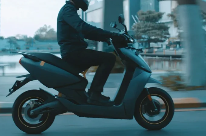 A rider on an Ather 450X electric scooter