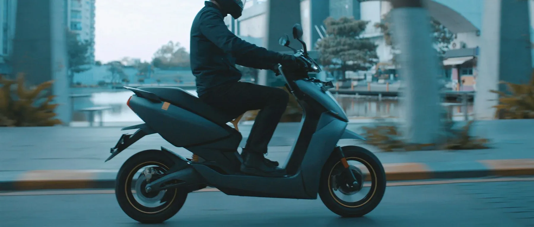 A rider on an Ather 450X electric scooter