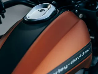 An orange and black Harley-Davidson motorcycle