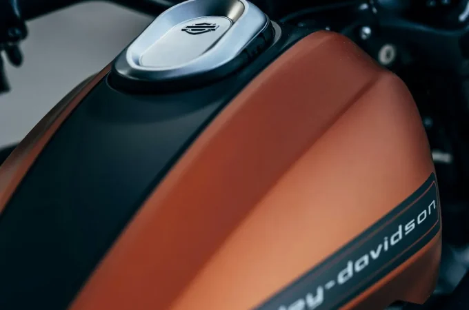 An orange and black Harley-Davidson motorcycle