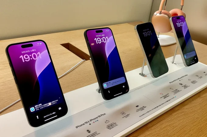 iPhone 16 devices on display in an Apple Store