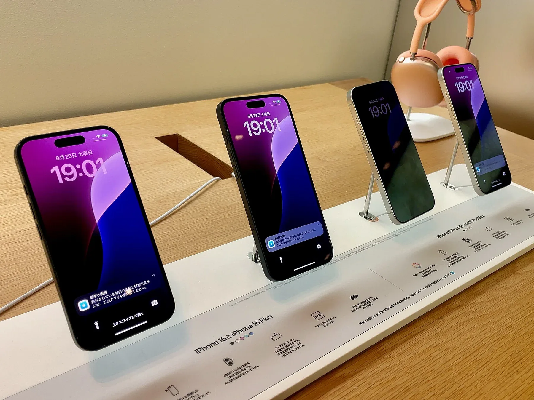 iPhone 16 devices on display in an Apple Store