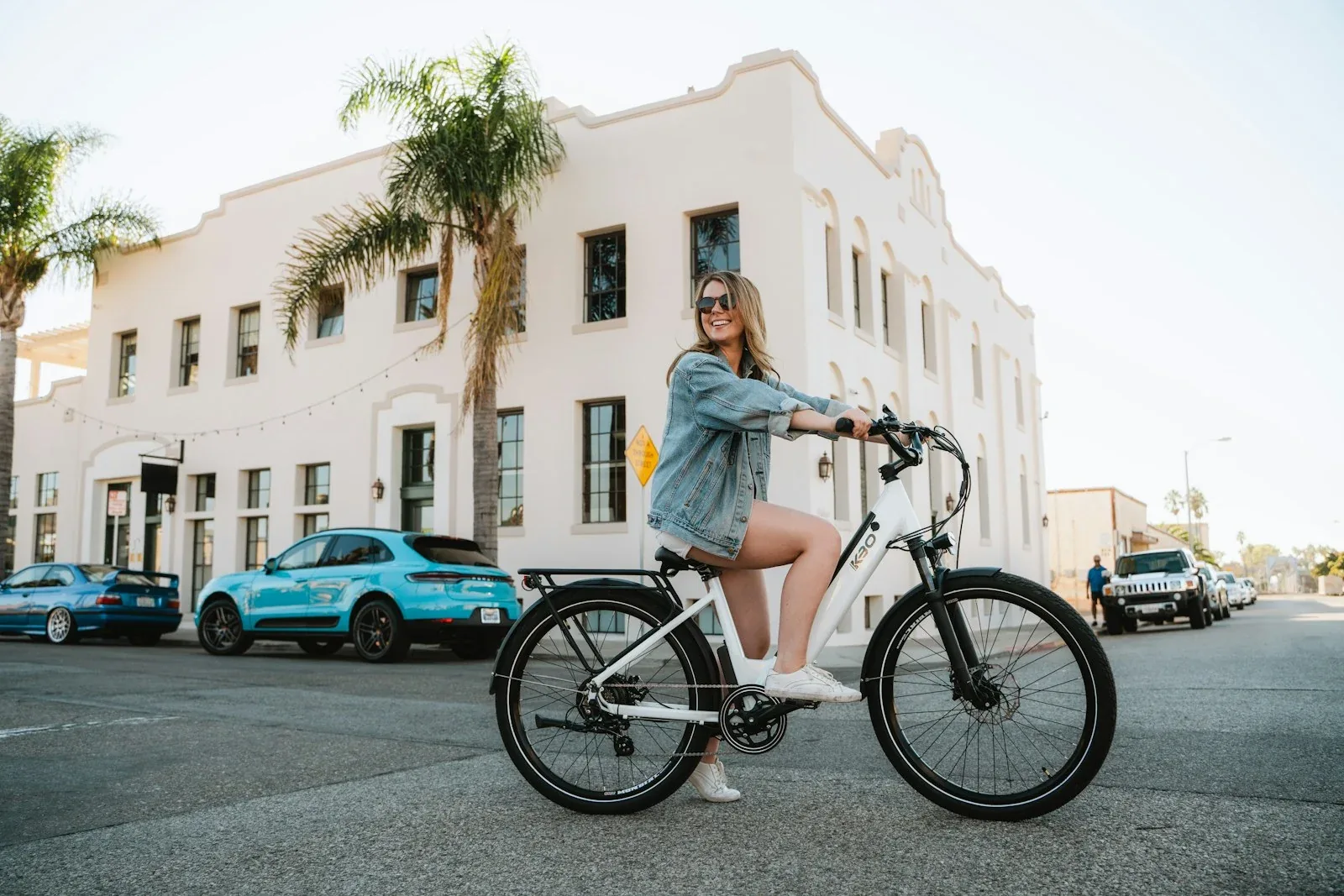 A rider using a KBO electric bicycle on a city street