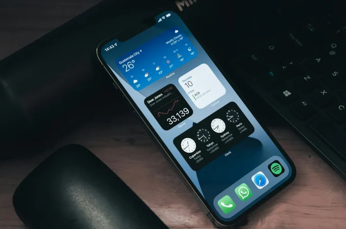 A real smartphone on a desk beside a keyboard