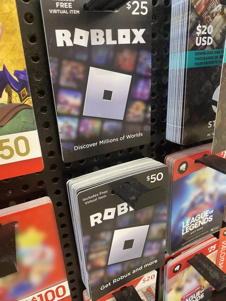 Roblox gift cards displayed on a shop rack